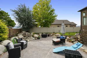 Fenced backyard with a patio area