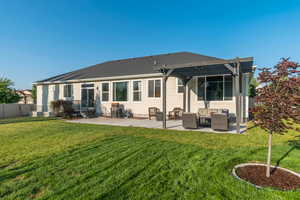 Rear view of house featuring entry steps, an outdoor hangout area, a patio, and a pergola