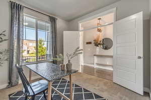 Carpeted office featuring baseboards