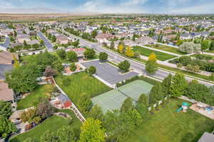 HOA tennis court, grass area, and playground.