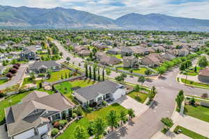 Aerial perspective of suburban area with a mountainous background