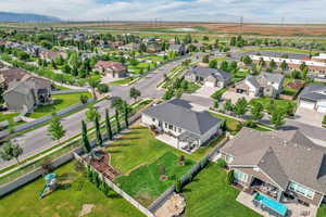 Aerial perspective of suburban area with a mountain backdrop