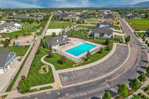 HOA pool 2 with grassy area, pickleball courts, basketball, and trails.