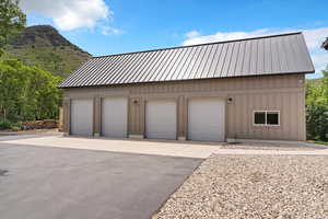 Detached garage with a mountain view
