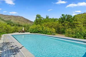 Outdoor pool with a mountain view