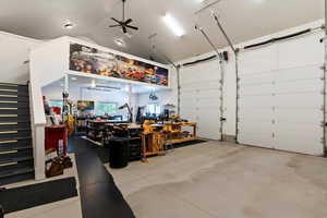Garage featuring a workshop area and ceiling fan