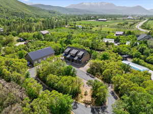 Drone / aerial view of mountains and a heavily wooded area