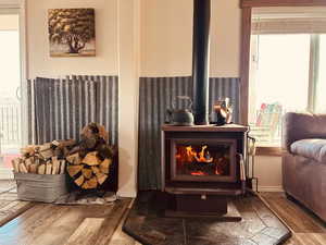 Detailed view of a wood stove and wood finished floors