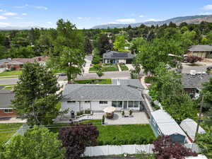 View of subject property featuring a mountainous background