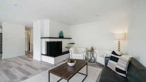 Living room featuring a brick fireplace