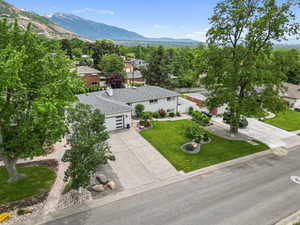 View from above of property with a mountain backdrop