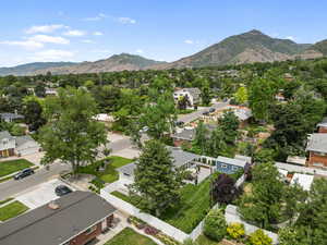 Aerial view of residential area featuring a mountainous background
