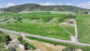 View of mountain backdrop with rural landscape