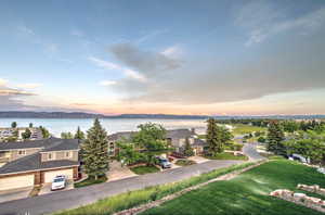 Aerial view at dusk of a water view and a residential view