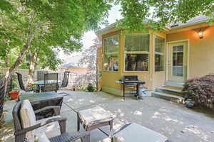 View of patio / terrace featuring entry steps and a grill