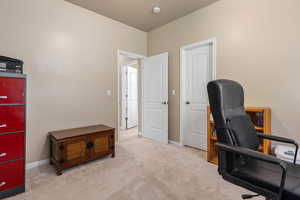 Carpeted office featuring baseboards