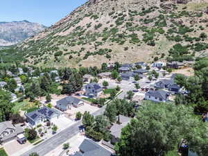 Aerial perspective of suburban area with a mountainous background