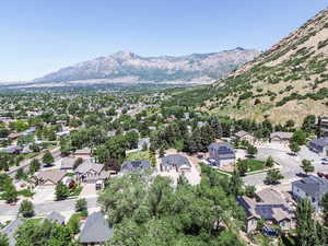 Aerial view of residential area featuring a mountainous background