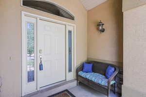 Property entrance with stucco siding