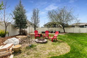 View of yard featuring an outdoor fire pit