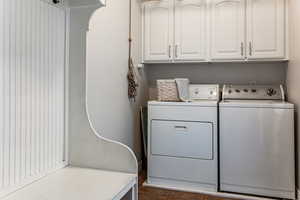 Laundry room with coat hooks and cubbies.