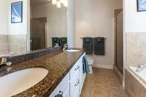 Primary bathroom with double sink vanity.