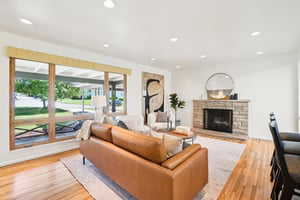 Living Room with double paned windows, fireplace, open to kitchen