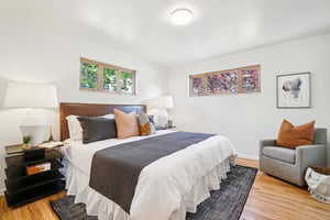 Bedroom with wood finished floors