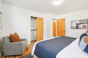 Bedroom with a closet and wood finished floors