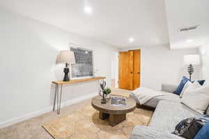 Living room with recessed lighting and baseboards