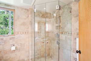 Full bath featuring a stall shower