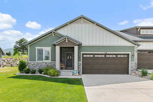 Craftsman-style twin home featuring stone and Hardy board exterior