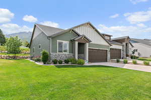 Craftsman-style twin home featuring stone and Hardy board exterior