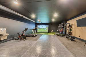 Workout area featuring baseboards