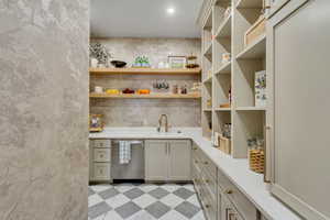 Pantry featuring a sink