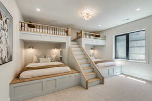 Bedroom with recessed lighting and light colored carpet