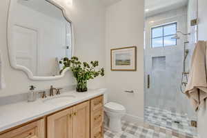 Full bathroom with a stall shower and vanity