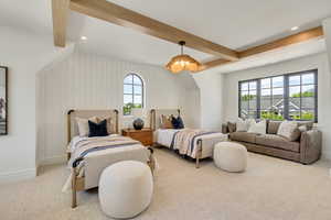 Carpeted bedroom featuring beamed ceiling and recessed lighting
