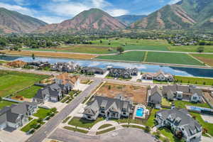 Aerial perspective of suburban area featuring a water and mountain view