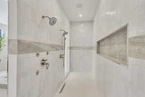Bathroom featuring tiled shower