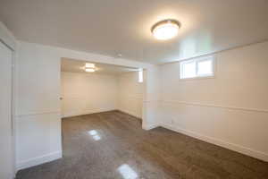 Basement with carpet floors and wainscoting