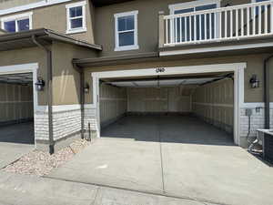 Garage featuring concrete driveway