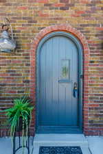 Property entrance with brick siding