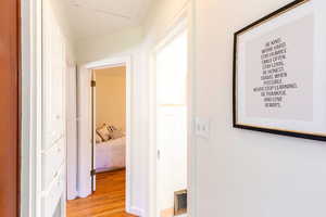 Corridor with light wood-style floors