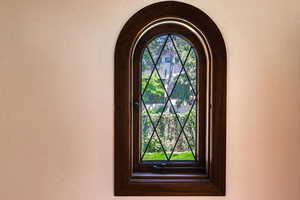 Detailed view of arched walkways and stucco siding