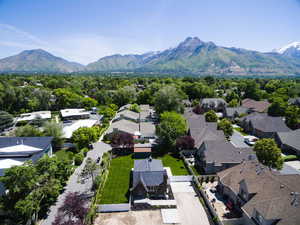 Aerial perspective of suburban area featuring a mountain backdrop