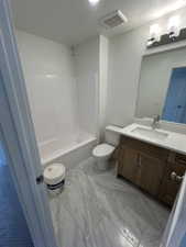 Full bathroom with vanity, toilet, shower / washtub combination, and marble finish floors