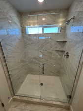 Full bath with a shower stall