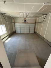Garage featuring a garage door opener