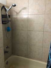 2nd floor full Bathroom featuring shower / bath combo with shower curtain